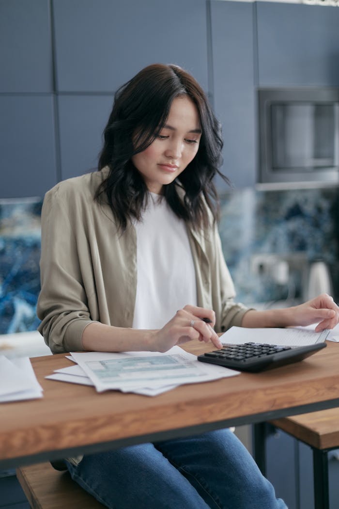 Woman Calculating Her Bills